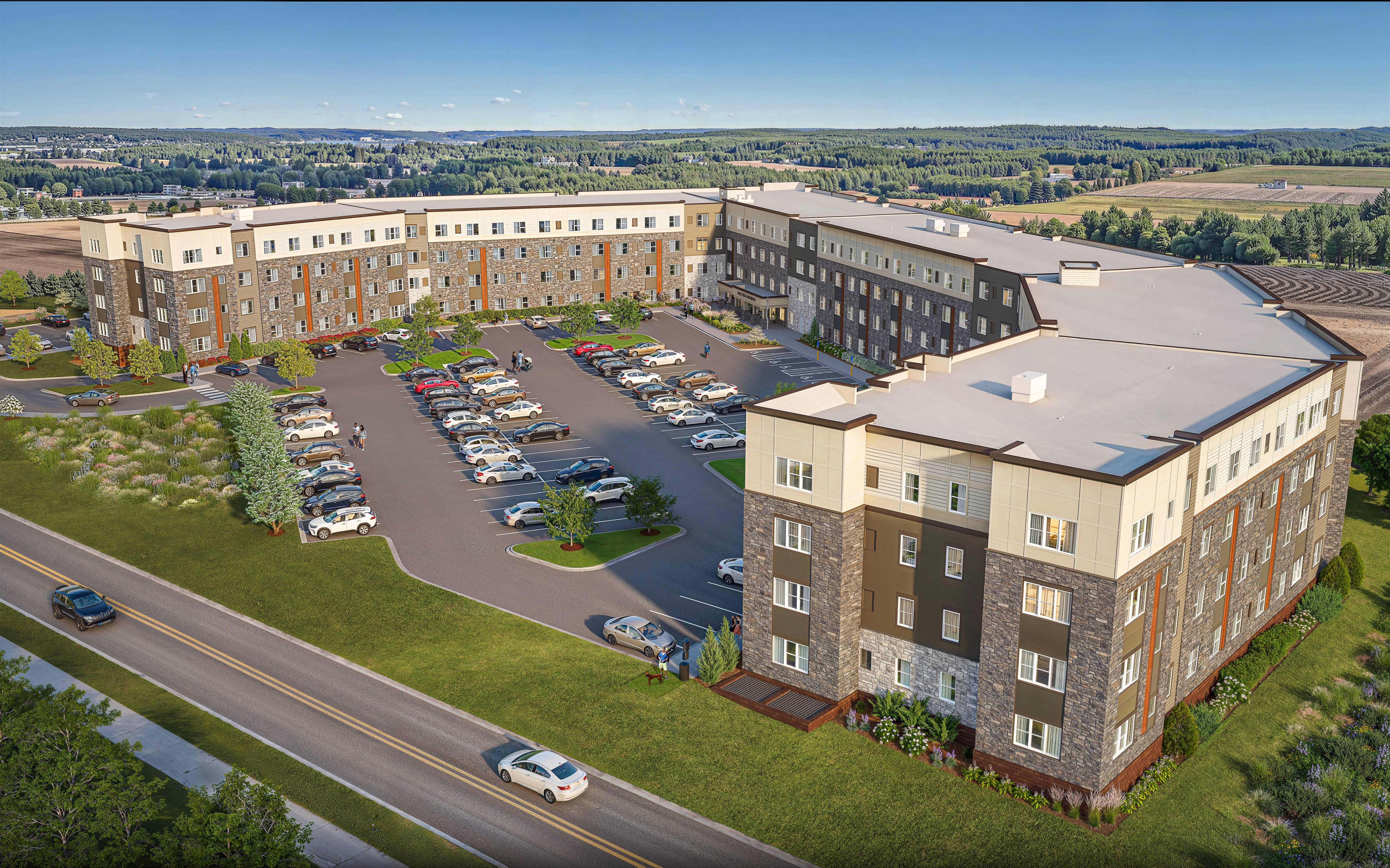A large building with a parking lot in front of it.